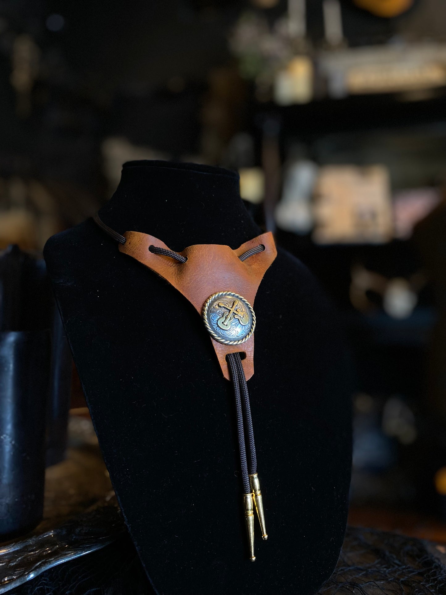 Leather Strapped Silver and Gold Guitar Motif Bolo Tie